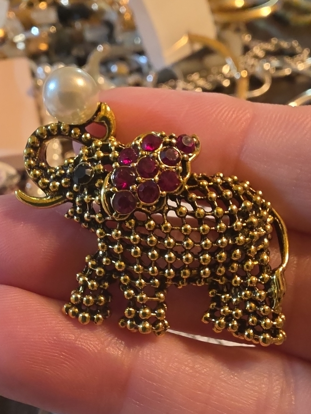 A89- Gold Elephant Brooch with Red Gem Accents
